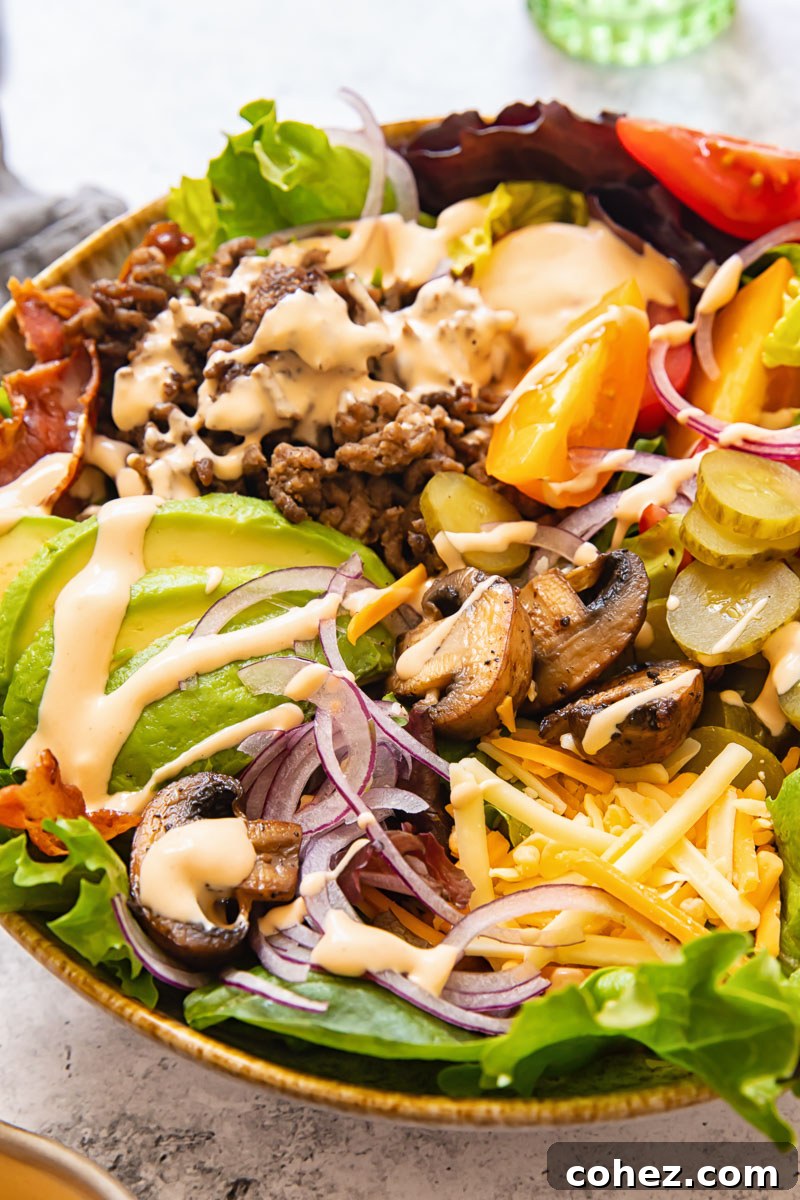 Flavor-Packed Burger Bowl 2 Loaded burger in a bowl salad, top-down view with various toppings