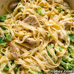Top-down view of chicken broccoli alfredo pasta