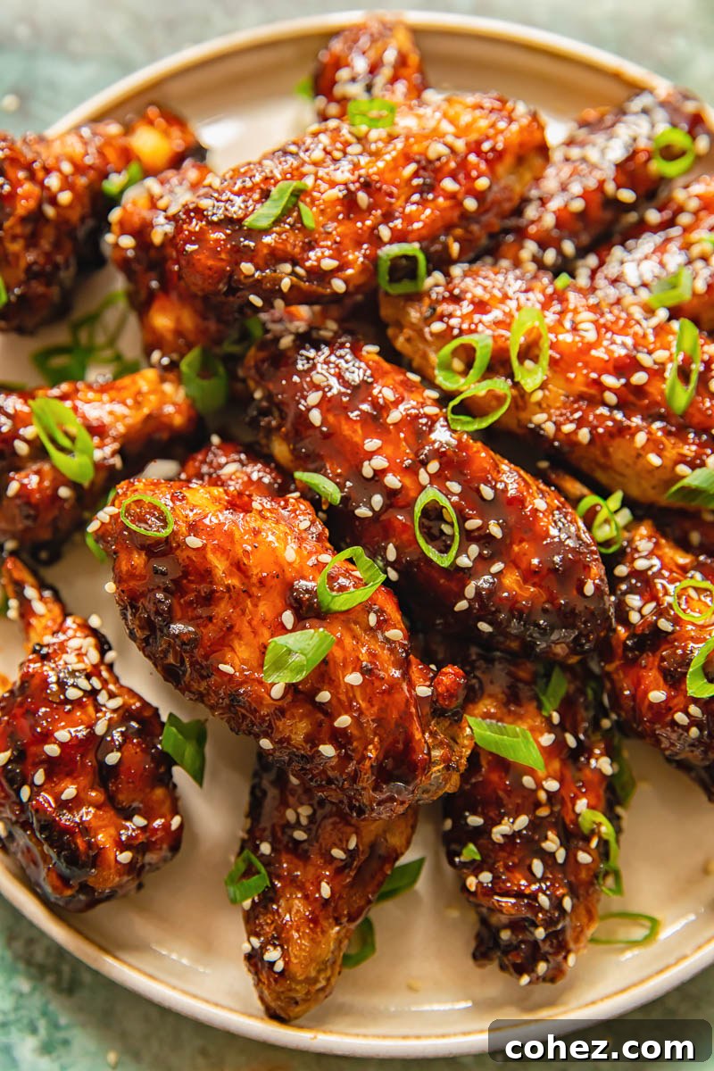 chicken wings coated in a glaze on a plate
