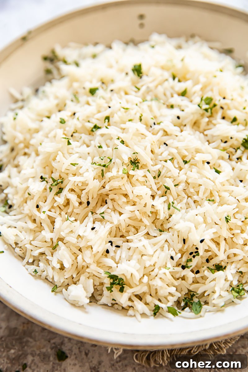 A close-up shot of fragrant coconut rice in a serving bowl, ready to be enjoyed.