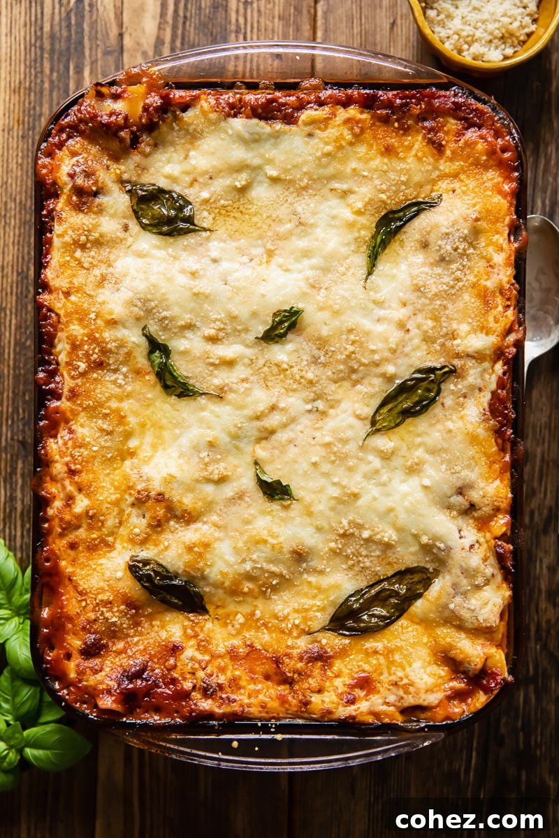 top down view of an uncut lasagne in a baking pan, ready to be served