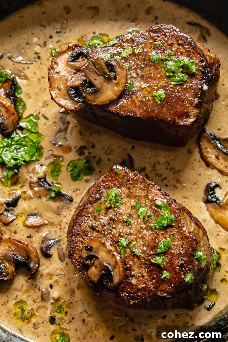 two fillet steaks in a creamy mushroom sauce