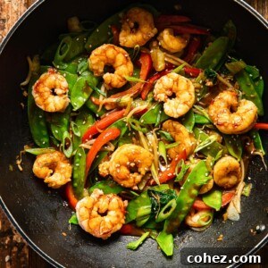 top down view of shrimp stir fried with vegetables in a wok