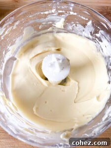 Maple Kissed Cream Cheese Cinnamon Buns 10 Maple cream cheese icing being prepared