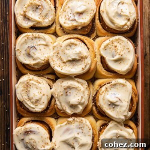 Maple Kissed Cream Cheese Cinnamon Buns 7 Top down view of cinnamon rolls in a baking pan, ready to be served.