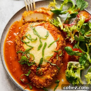 chicken parmesan on a plate with salad