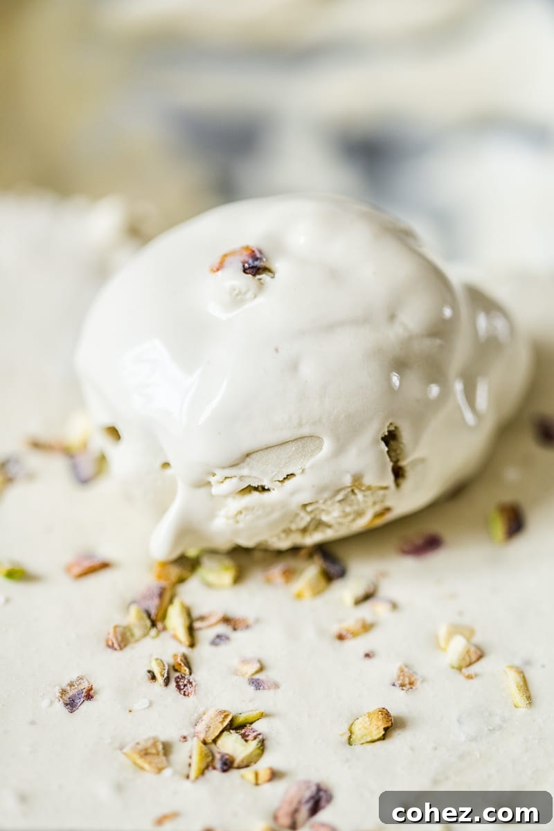 Effortless Pistachio Ice Cream Bliss 5 A scoop of rich pistachio ice cream, showcasing the flecks of chopped nuts.