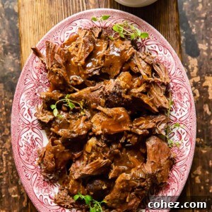 top down view of lamb in red wine sauce on a platter
