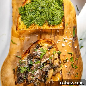 Mushroom crostini on a wooden board, ready to be served.