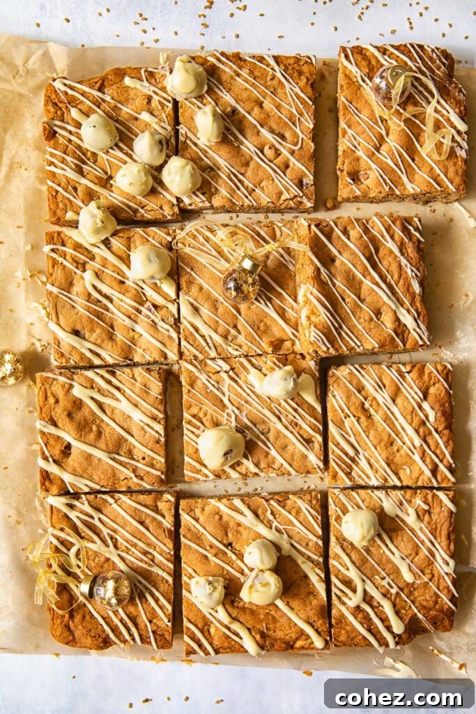 Top down of brown butter hazelnut blondies cut into squares, showcasing a rich, golden color and visible hazelnut pieces.