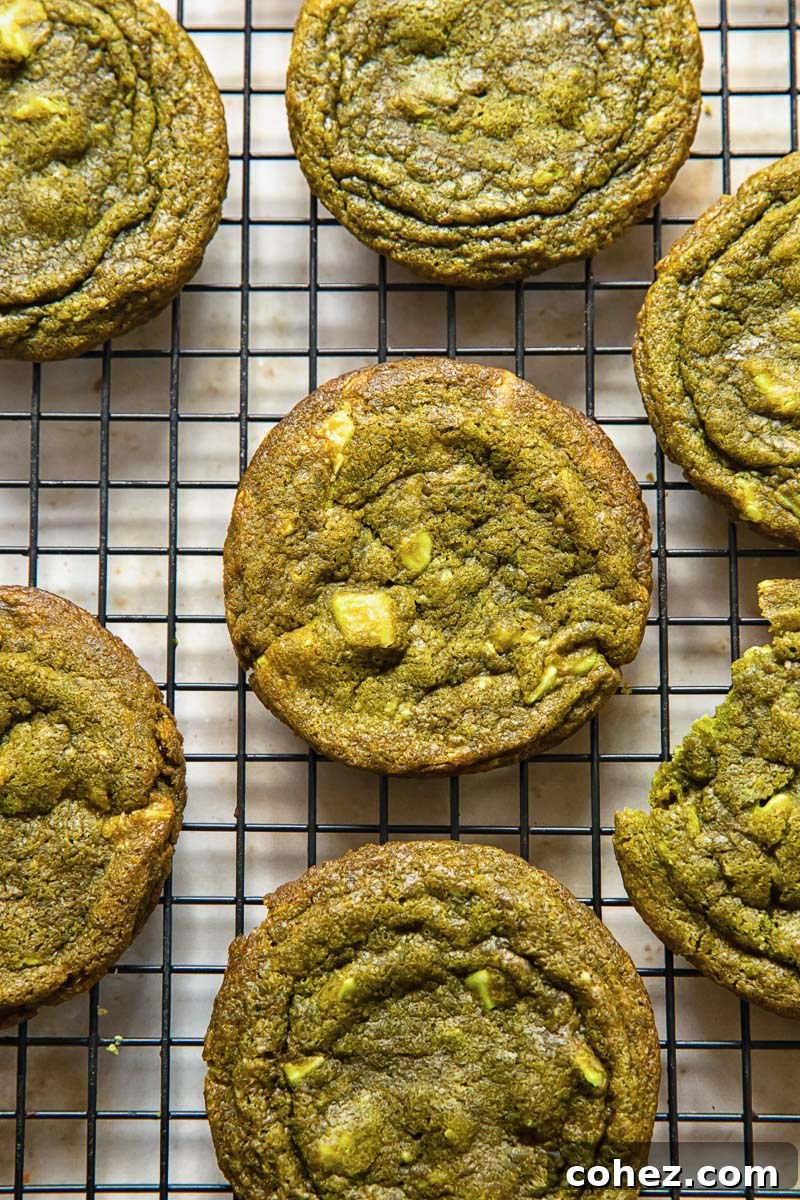 Close-up of baked matcha cookies cooling on a wire rack