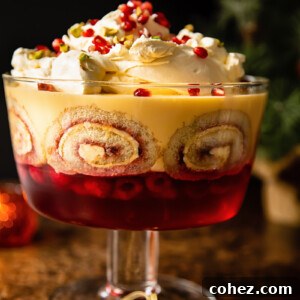 view of traditional trifle in a trifle bowl with Christmas tree in background