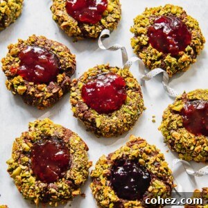 Chocolate-Filled Thumbprint Delights 6 top down view of Christmas cookies filled with jam