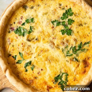 Top-down view of quiche on a round cutting board