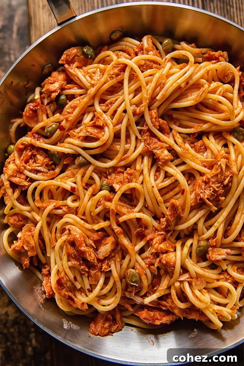 close up of spaghetti with tuna in a red sauce