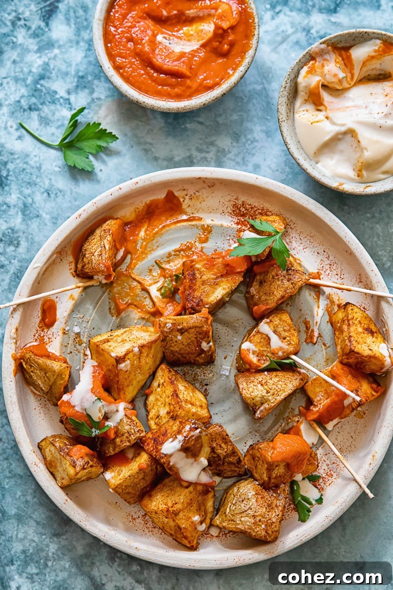 half eaten plate of patatas bravas