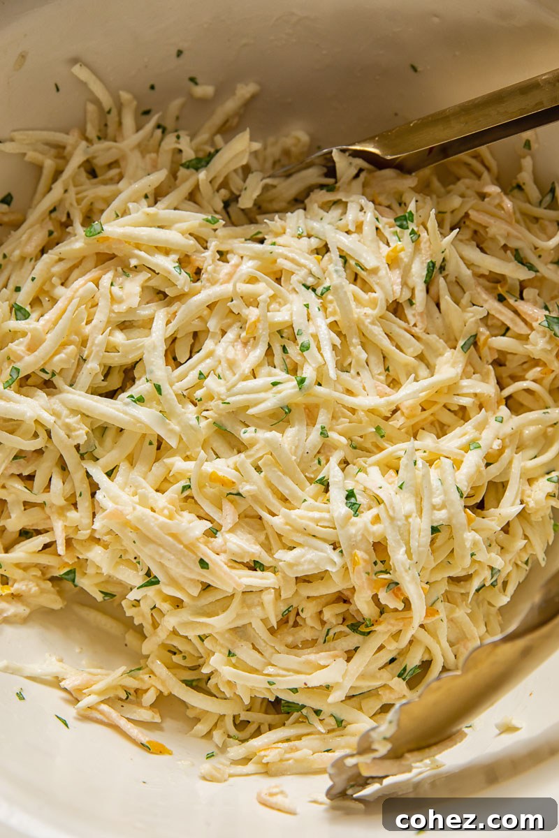 Tangy Celeriac Slaw 3 close up of grated celeriac slaw in a bowl
