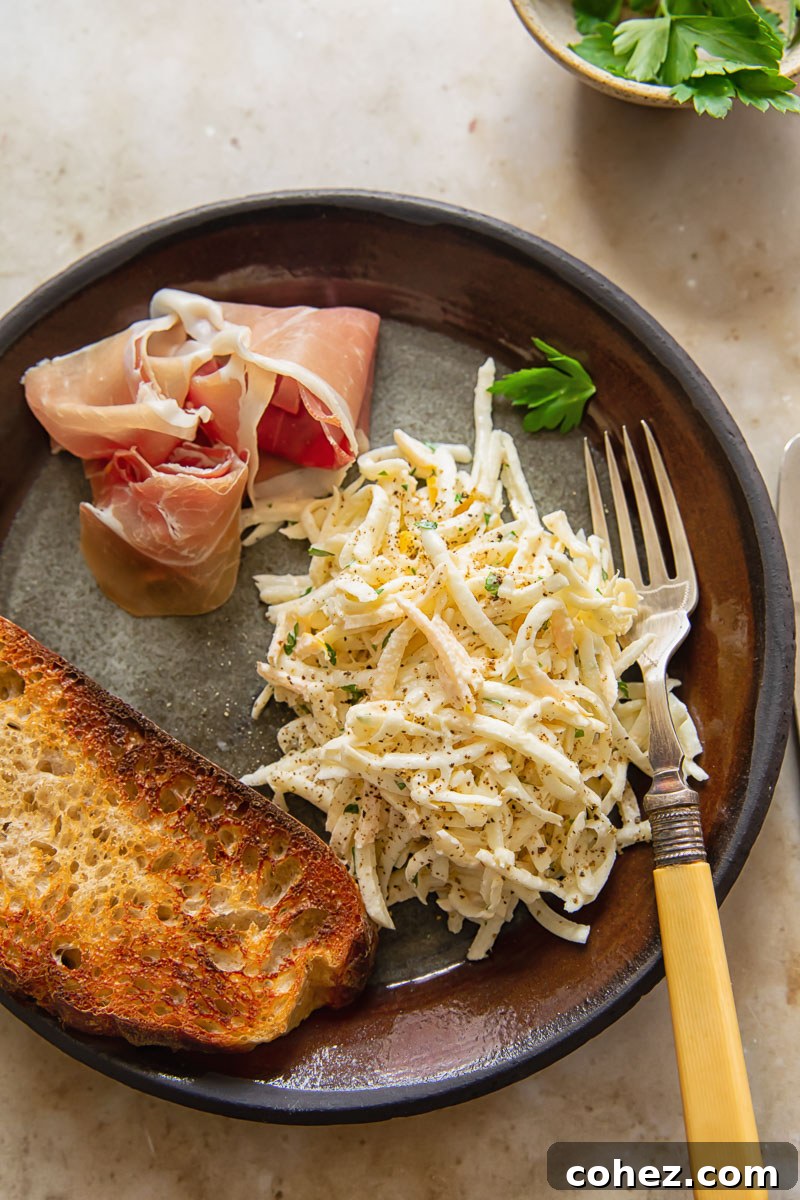 Tangy Celeriac Slaw 5 top dow view of a starter plate with celeriac remoulade, toasted sourdough bread and prosciutto