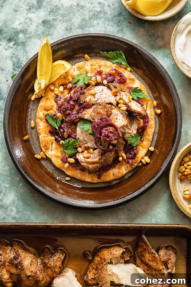 Palestinian Sumac Chicken 3 Top down view of Chicken Musakhan on flat bread with roasted chicken in pan, displaying the components before assembly