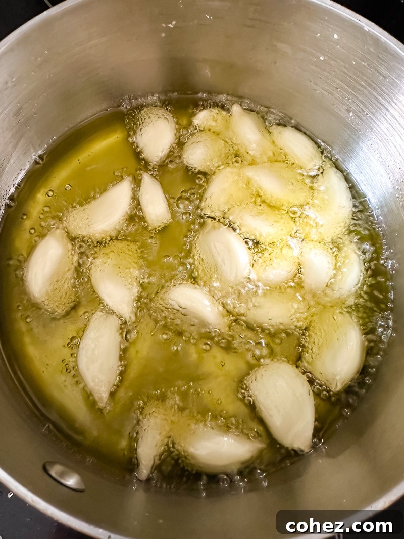 garlic cloves in sizzling olive oil in a pan