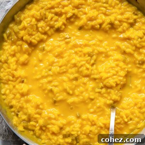 top down view of a pan of yellow saffron risotto