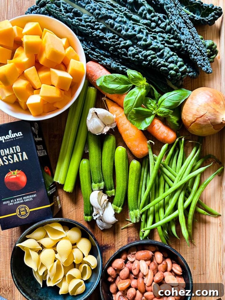Top down shot of fresh minestrone ingredients like kale, butternut squash, and beans on a wooden board, ready for preparation.