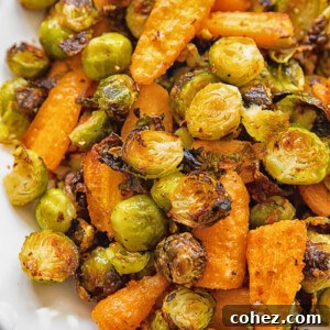 close up of a serving plate with roasted brussels sprouts and carrots