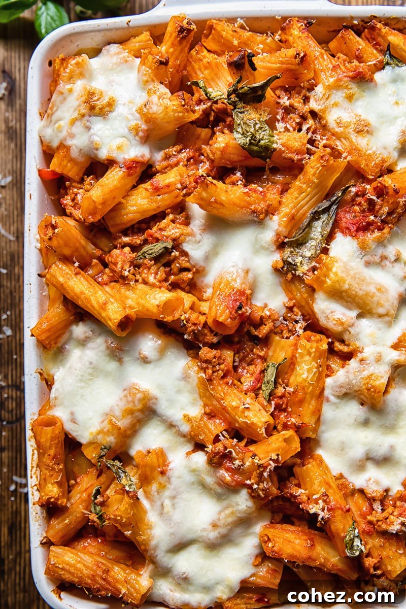 Hearty Pasta Bake 4 Top down view of pasta al forno with melted cheese in a baking dish