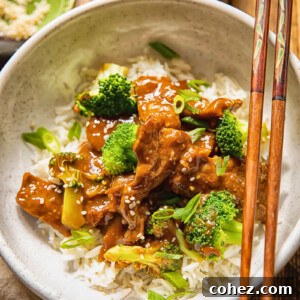 bowl of beef and broccoli stir fry with chop sticks