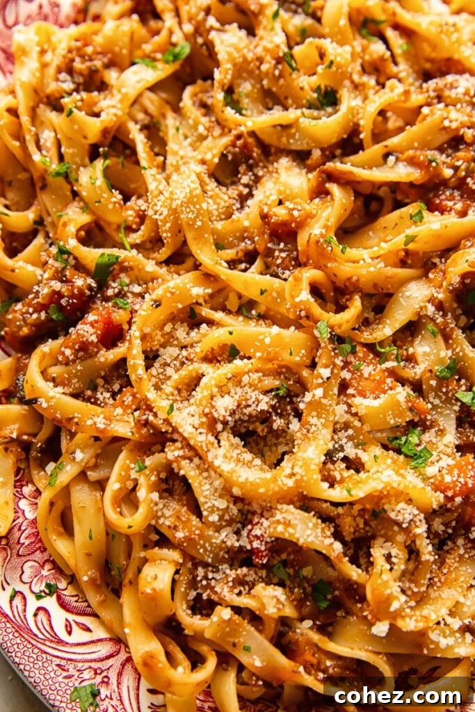 Close up of pasta mixed with bolognese