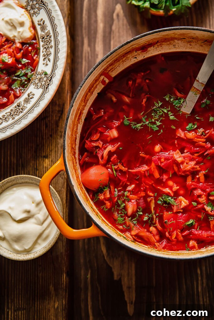 top down of vegetarian borscht in a pot on a wooden table