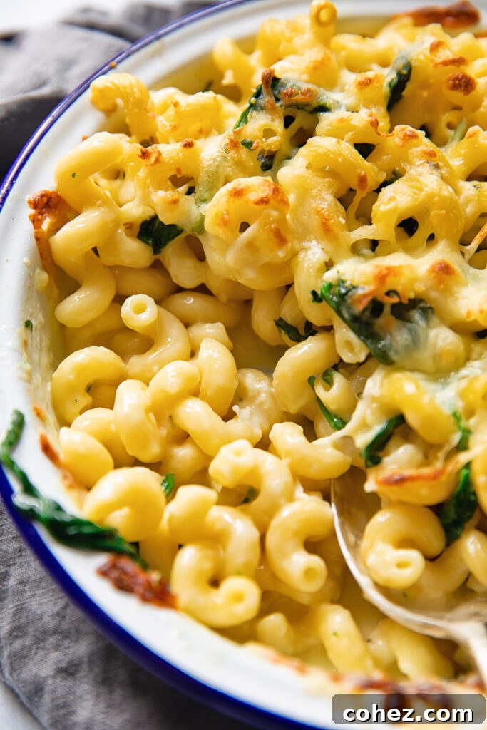 Baking dish of pasta showing oozing cheese on the inside