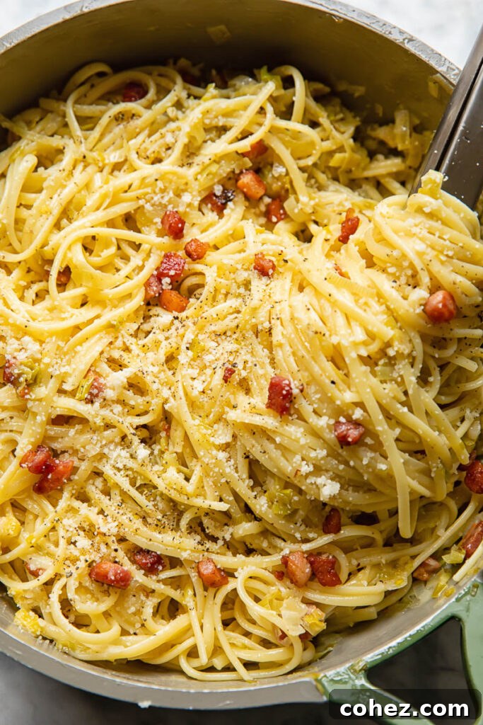 Golden Leek and Crispy Pancetta Linguine 3 pan of creamy leeks and pancetta pasta with tongs