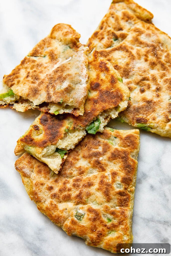 Golden Irish Potato Griddlecakes 2 Close up shot of cut open pieces of irish potato farls stack on top each other