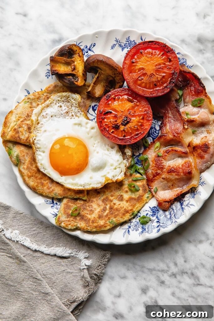 Golden Irish Potato Griddlecakes 3 Top down shot of Irish potato farls on a plate served with bacon and eggs