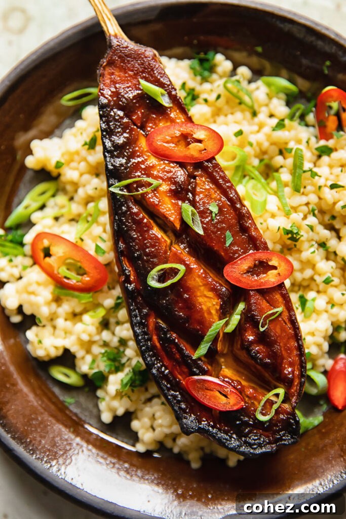 close up of a miso aubergine on a plate with couscous