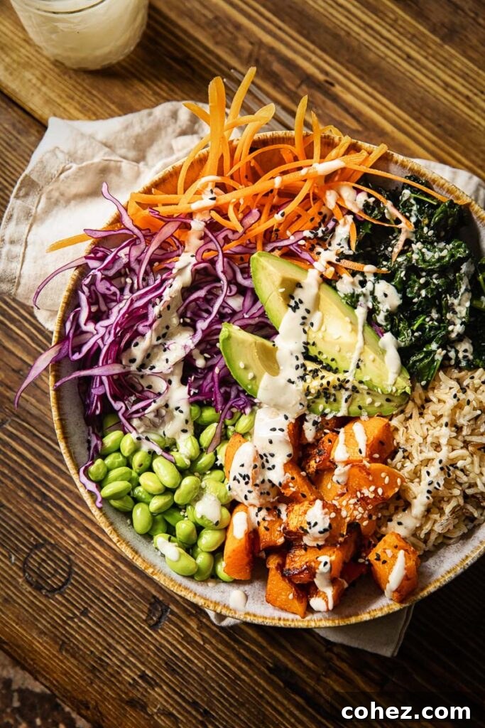 Vibrant Vegan Harvest Bowl 5 Top down view of a beautifully presented Buddha bowl on a wooden table, ready to be enjoyed.