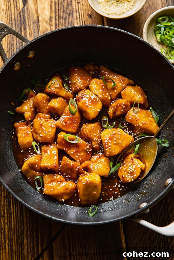 top down of a wok with honey sesame chicken