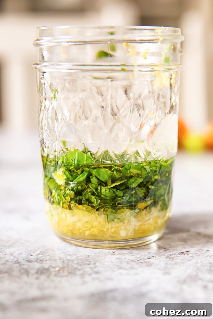 Jar with vibrant lemon basil vinaigrette