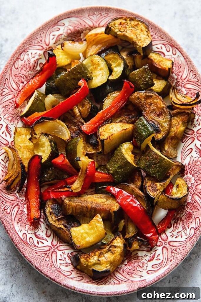 A vibrant platter of perfectly roasted vegetables, showcasing their rich colors and inviting textures.