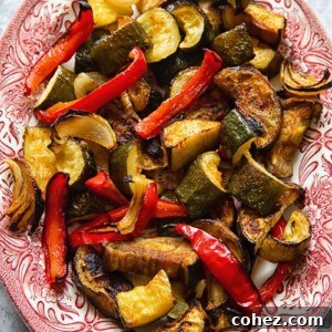 A vibrant platter of perfectly roasted vegetables, showcasing their rich colors and inviting textures.