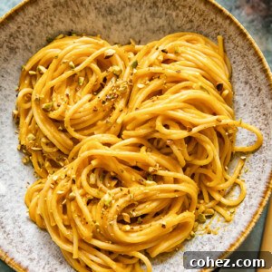 Bowl of roasted butternut squash pasta with pistachio crumb