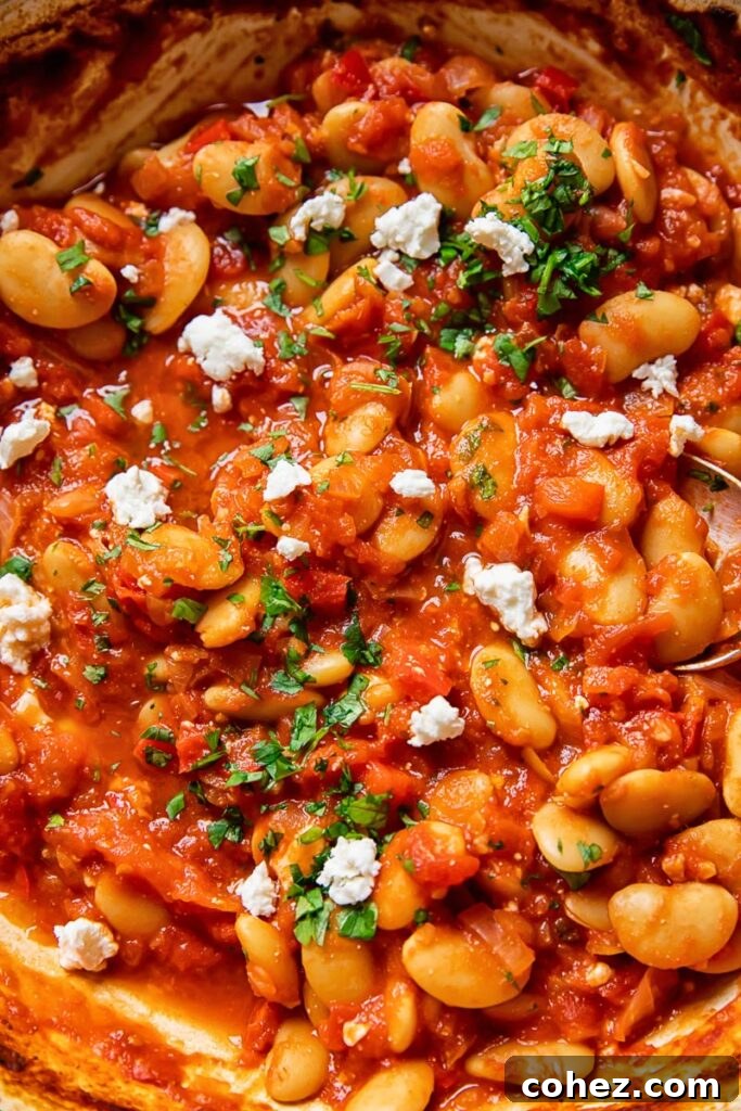 Gigantes Plaki 4 Butter bean stew with added herbs in a pan