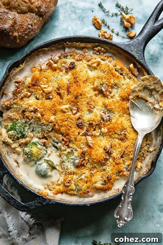 Top down shot of Brussels sprouts gratin topped with golden-brown breadcrumbs in a rustic baking dish, ready to be served.