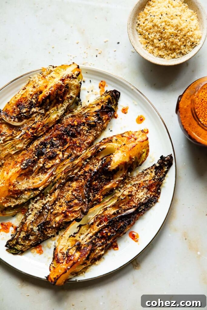 Gochujang Cabbage with Golden Crunch 4 Gochujang roasted cabbage on a plate next to a bowl of breadcrumbs