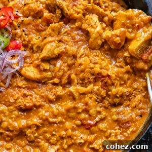 Top down shot of turkey and lentil curry in a wide pan