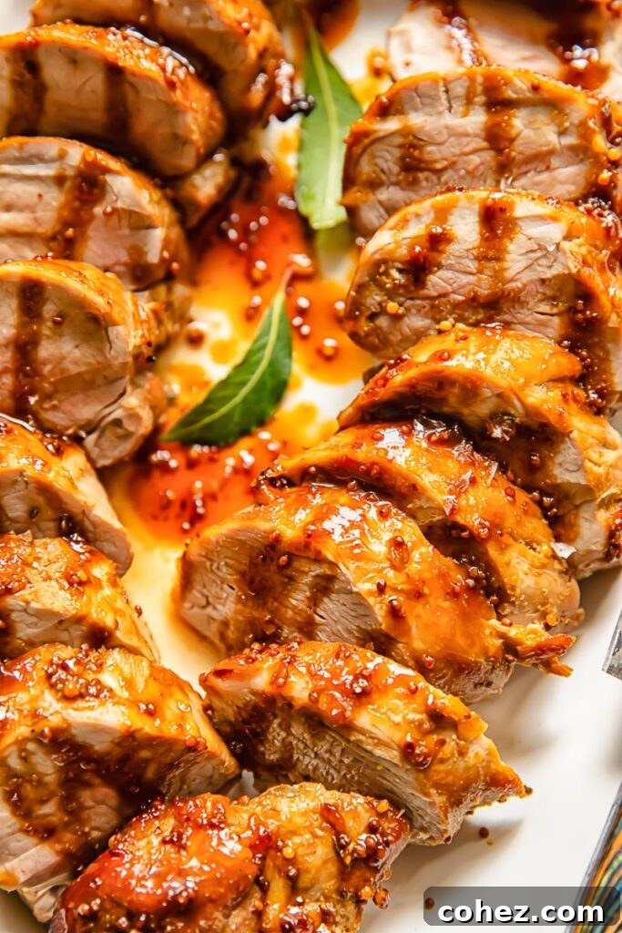 Top down shot of molasses pork loin slices on a plate