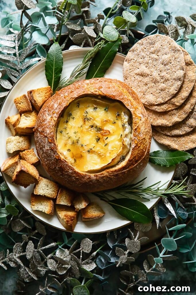 Top down shot of baked camembert in a bread bowl