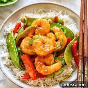 Sweet Heat Shrimp Stir-Fry 6 Top down shot of shrimp stir fry in a bowl with chopsticks
