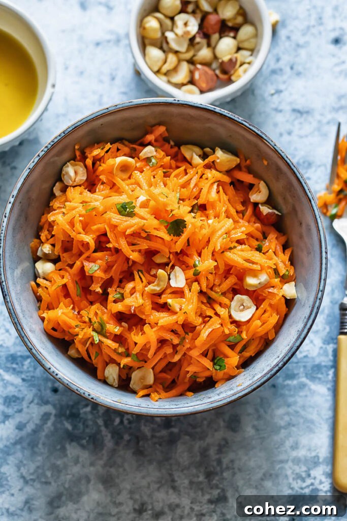 Top down shot of french carrot salad in a small bowl